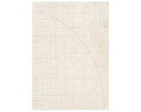 A beige area rug with a geometric pattern.