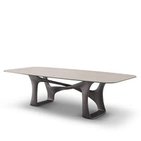 Modern coffee table with a unique base design on a white background