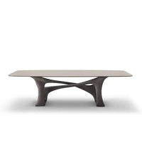 Modern coffee table with a unique base design on a white background