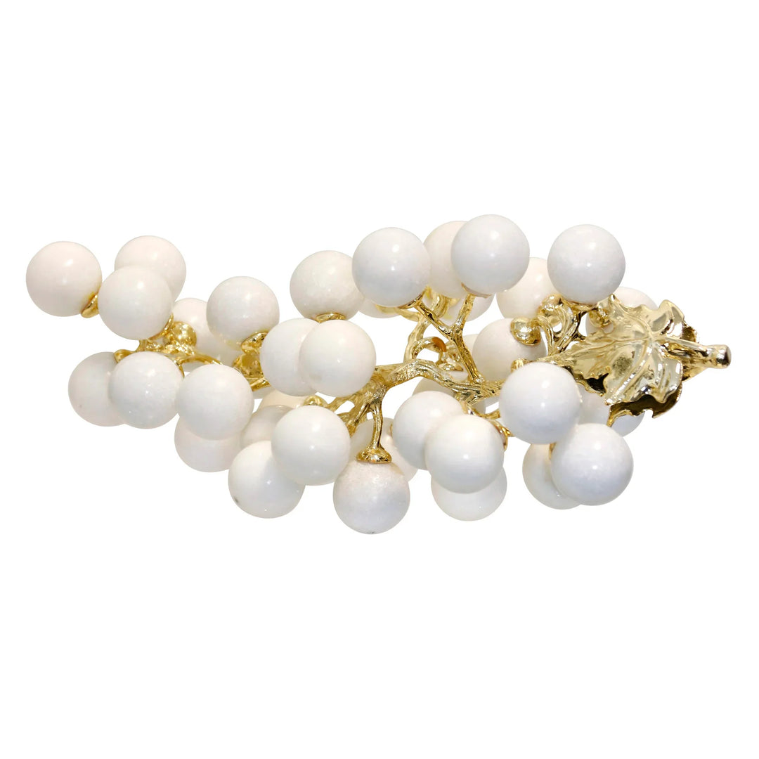 Pearl bracelet with gold accents on a white background