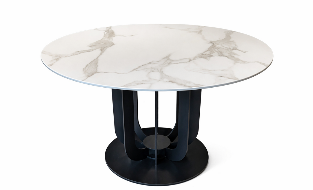 Round marble table with a black base on a white background