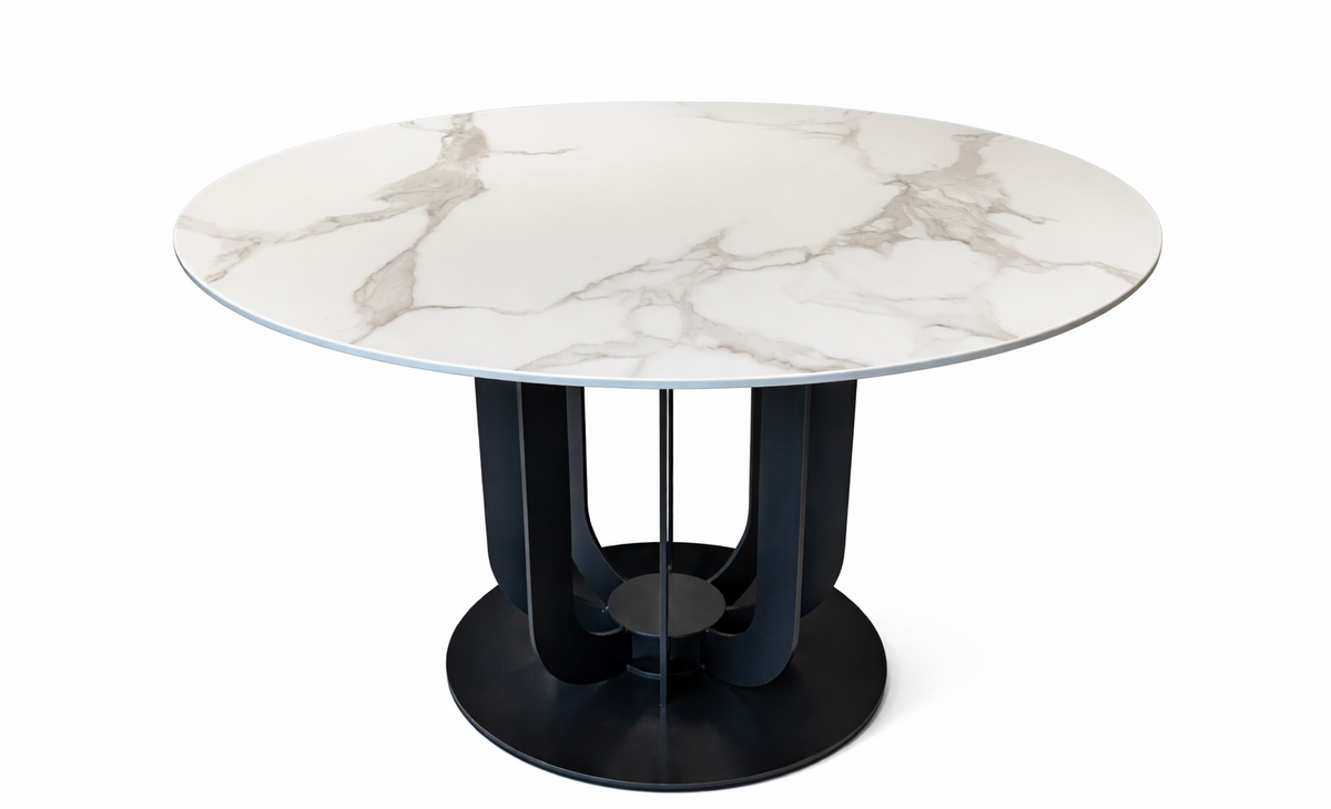 Round marble table with a black base on a white background