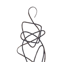 Close-up to a cast aluminum statues with an oil rubbed bronze finish on a black base, in a minimalist design, portraying abstract curvilinear forms.