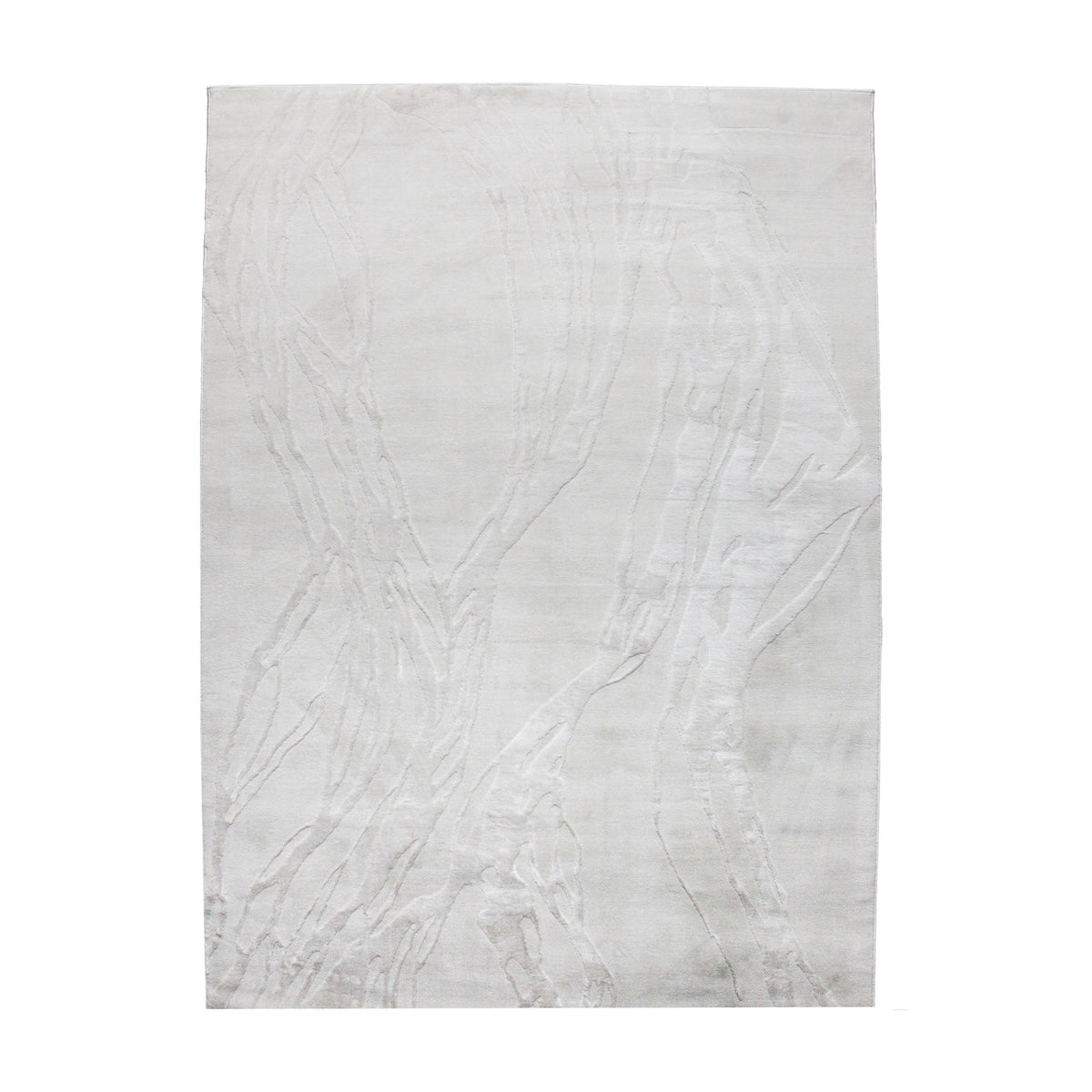 A power loomed Mila Area Rug in off white with a polypropylene and polyester construction and jute backing.