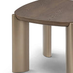 Wooden table with bronze legs on a white background