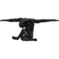 Black abstract sculpture of a figure on a white background