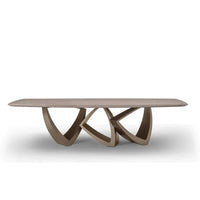 Modern coffee table with unique base design on a white background