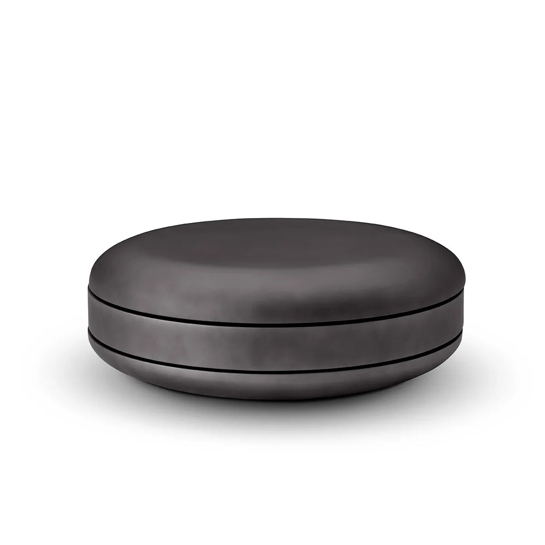 Black round ottoman on a white background
