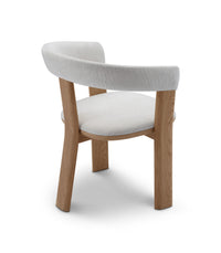 Chair with wooden frame and white cushion on a white background