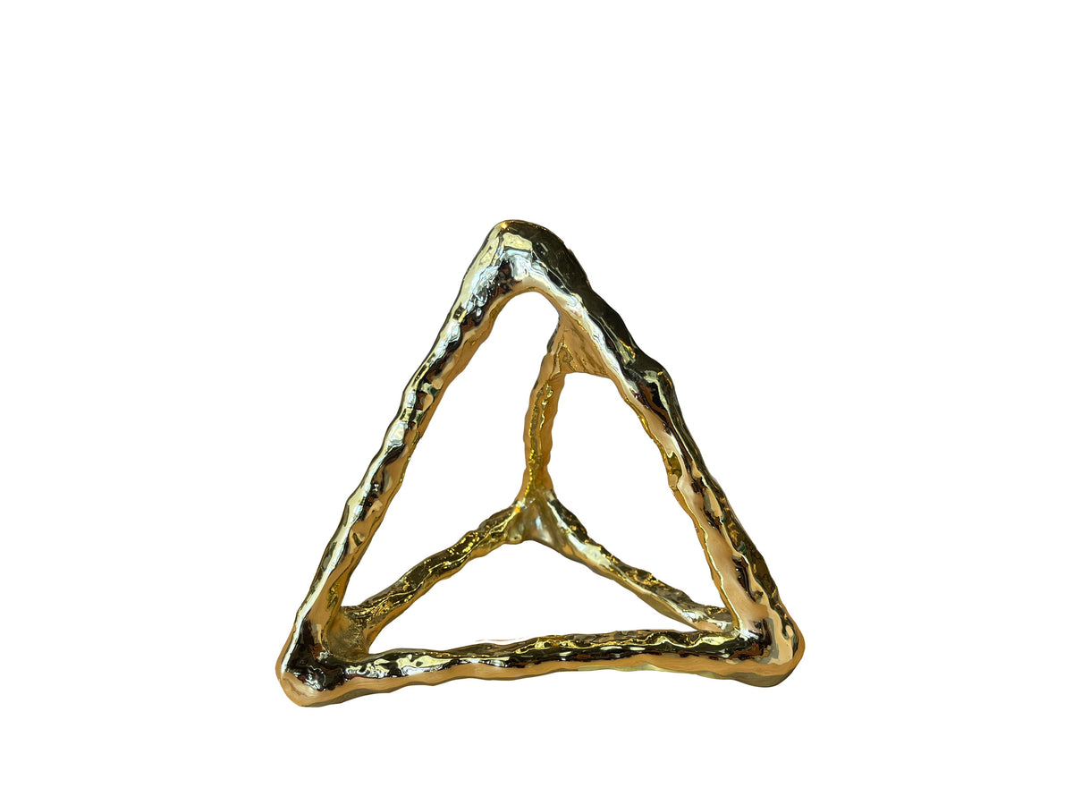 Gold geometric ring on a white background