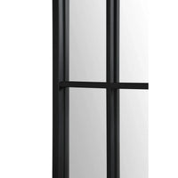 A large full-length mirror with an arched frame and grid-like iron details.