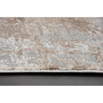 A rectangular area rug featuring a subtle pattern with muted brown and grey tones, suitable for contemporary living or bedroom spaces.