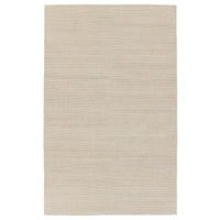 A beige area rug with a flatweave construction, laying on a white background.
