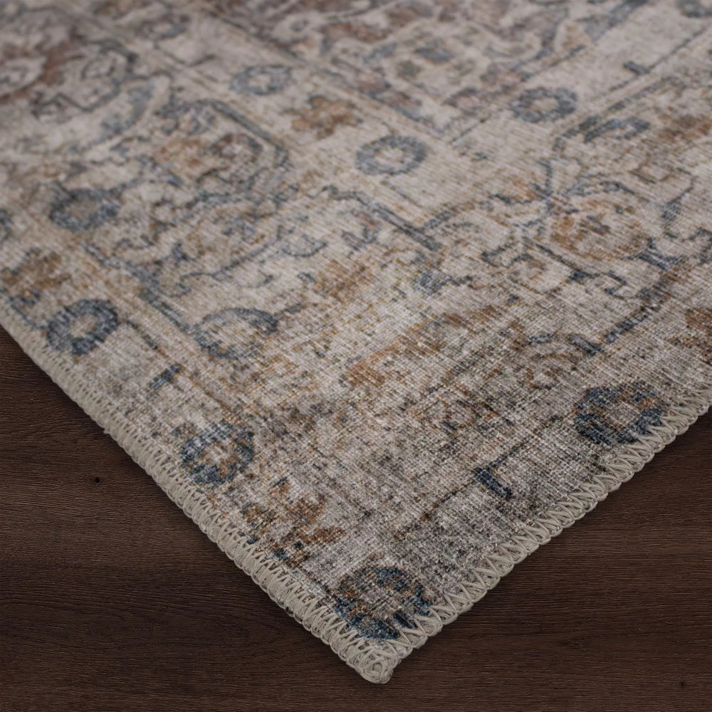 Close-up view of a multicolored area rug with a flatweave texture, showcasing patterns and colors.