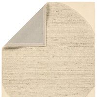Beige textured rug corner on a white background