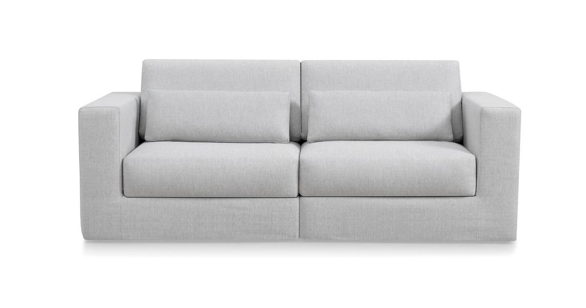 A gray modular sofa with a flat-profile backrest and cushioned seats.