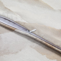 Close-up of a zipper on a textured fabric surface