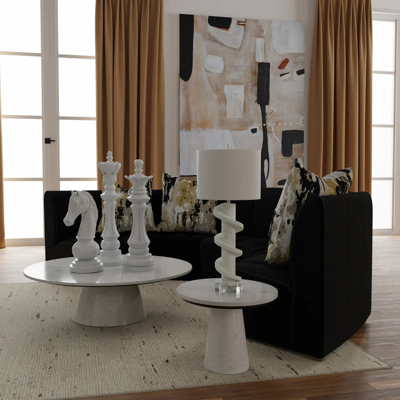 Modern living room with black sofa, white coffee table, and decorative items.