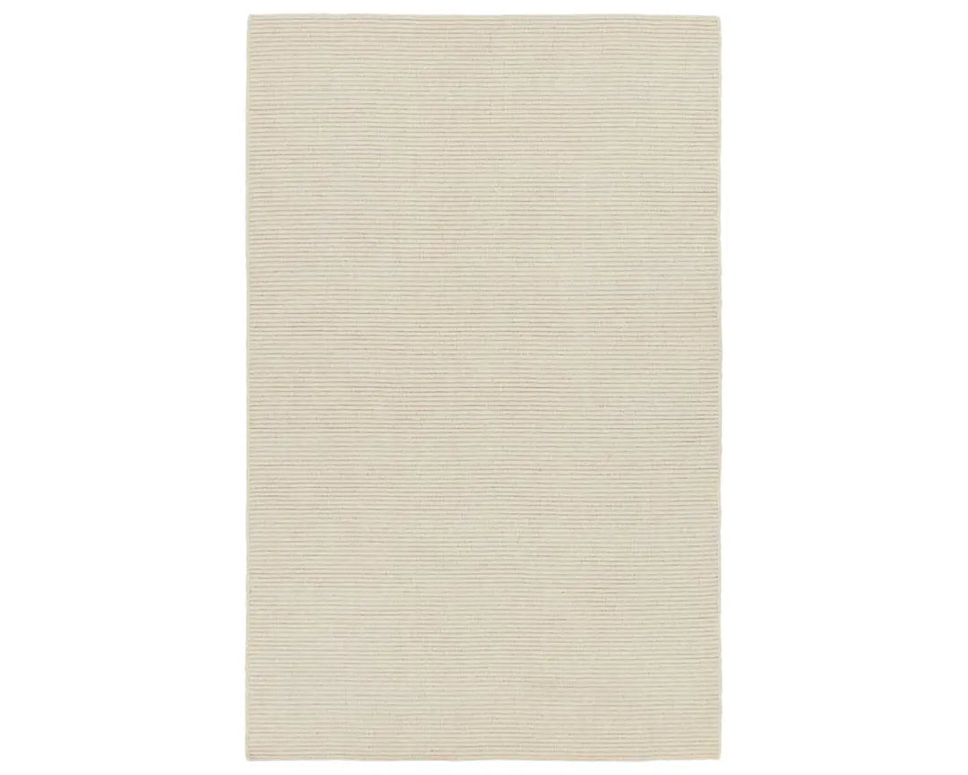 A beige area rug with a textured weave, laid out flat.
