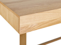 Close-up of a wooden table corner with a white background