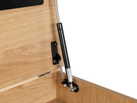 Black hydraulic lift on a wooden surface