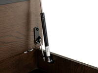 Wooden cabinet with a black hydraulic lift mechanism on a white background