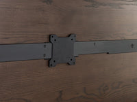 Metal hinge on a wooden surface