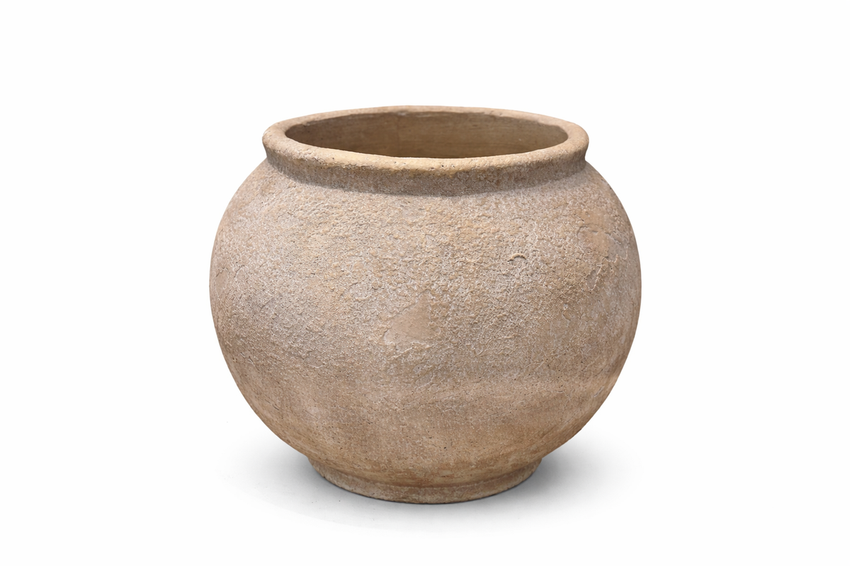 Textured beige pot on a white background