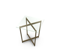 Modern glass table with geometric metal frame on a white background