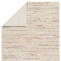 A power loomed area rug with beige and brown tones.