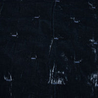 Close-up of dark textured fabric with visible patterns