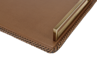 A leather tray with gold finished handle