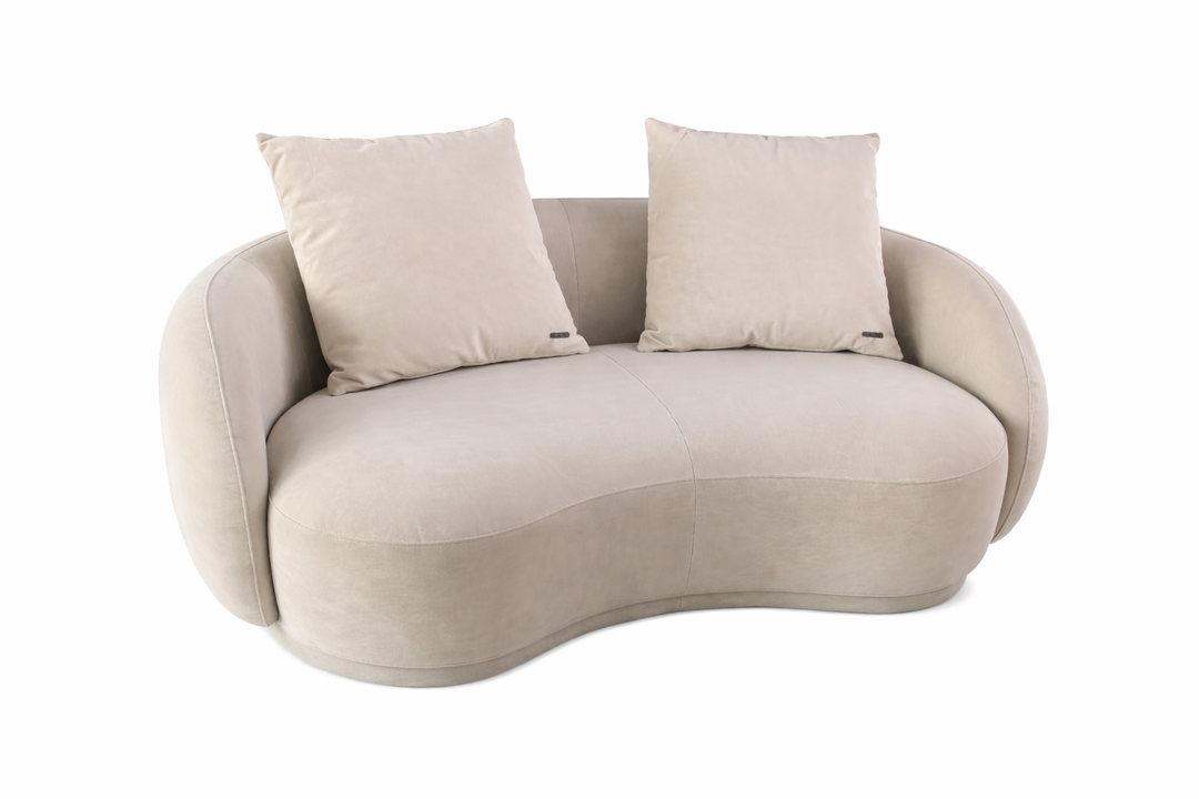 Beige wavy sofa with two cushions on a white background