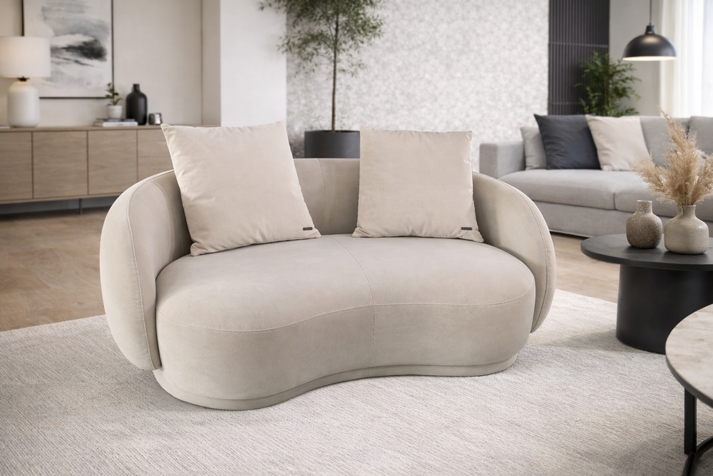 Modern living room with a beige wavy sofa and stylish decor.