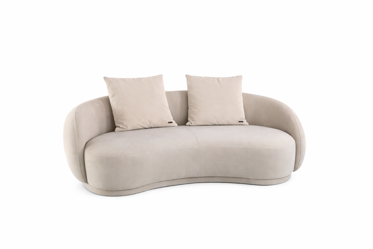 Beige sofa with two cushions on a white background