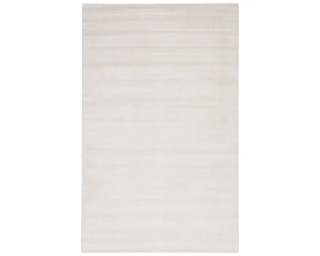 A white, solid color area rug on a plain background.